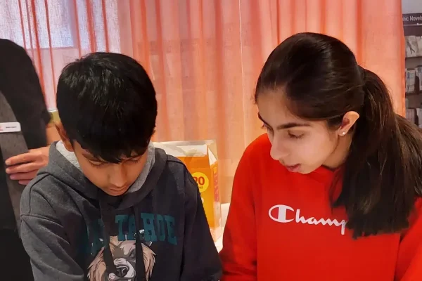 Kids working on a science project together.