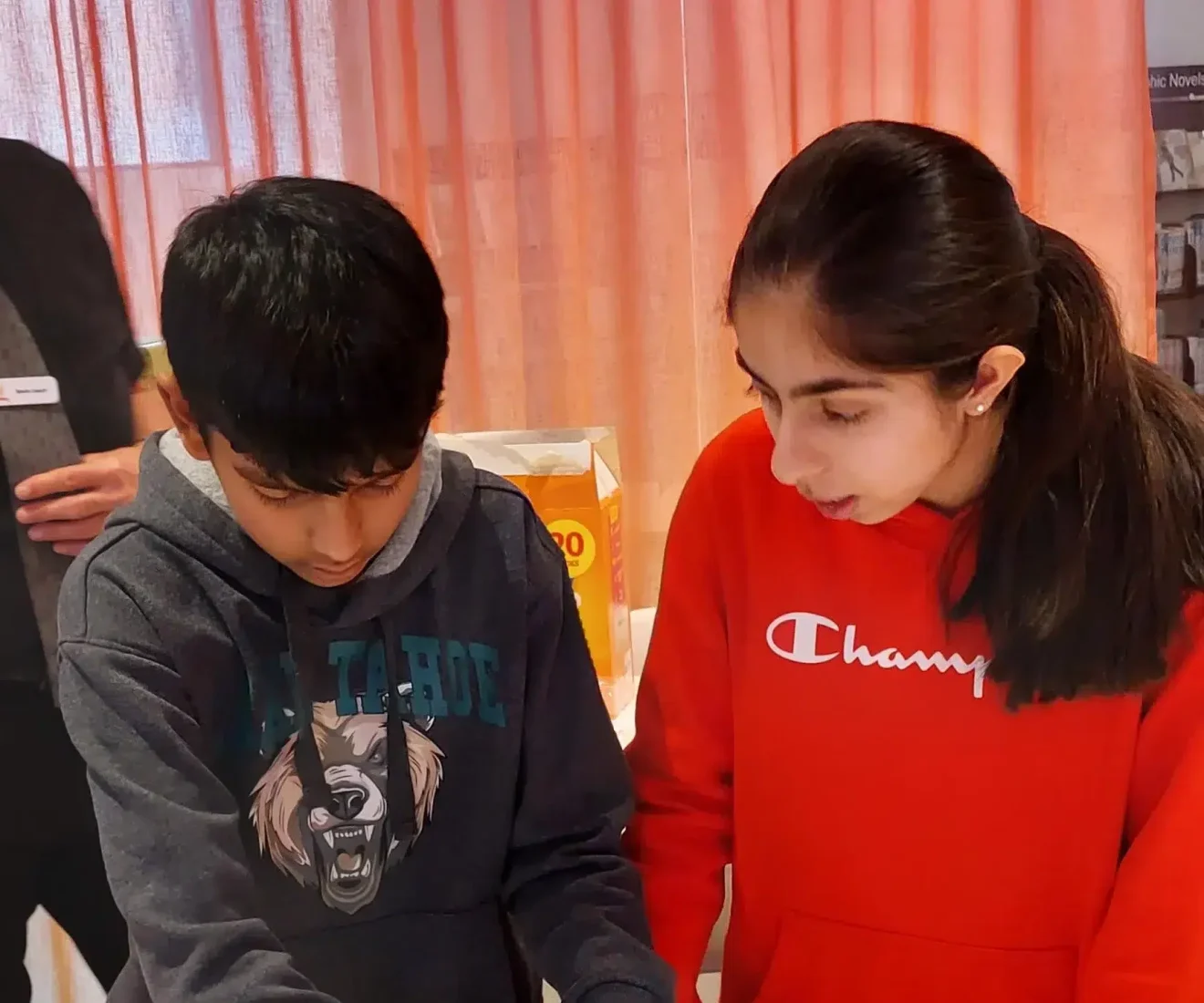 Kids working on a science project together.