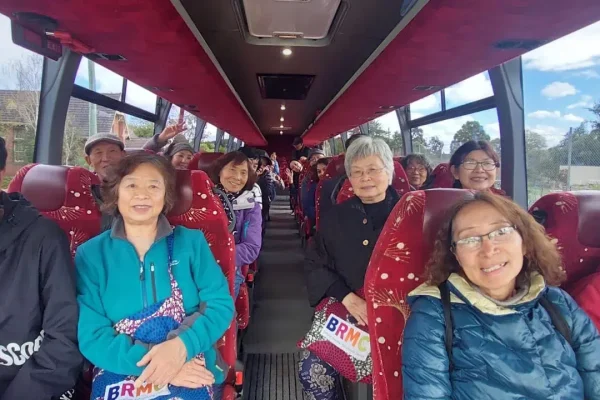 Group of happy seniors on a bus trip.