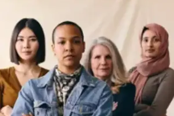 Diverse group of four confident women standing together.